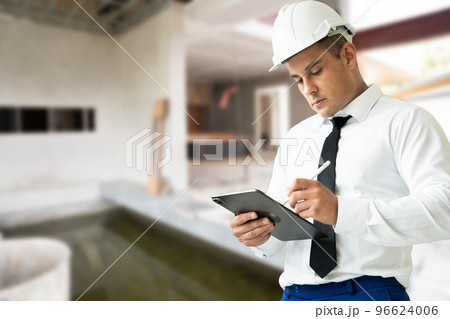 Asian worker man working in safety work wear helmet in factory workshop industry machine professional. Asian worker man working in safety work wear helmet in factory workshop industry machine professional. 96624006