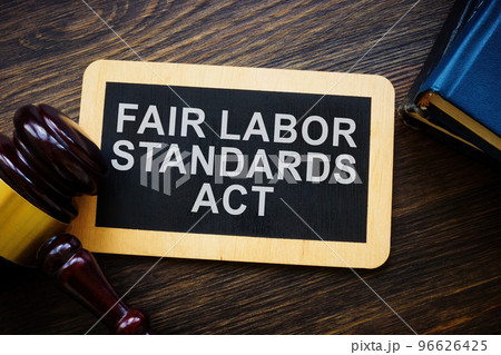 Plate with words Fair labor standards act FLSA and gavel. 96626425