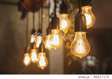 Chandelier with edison lamps in a dark room 96627170