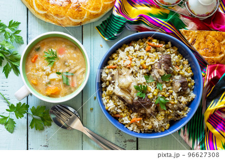 Eastern cuisine. Homemade Soup with bean mung and rice with bean mung and beef. Top view flat lay background. Eastern cuisine. Homemade Soup with bean mung and rice with bean mung and beef. Top view flat lay background. 96627308
