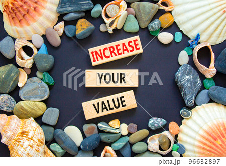 Increase your value symbol. Concept words Increase your value on wooden blocks on a beautiful black table black background. Sea shell and stone. Business increase your value concept. Copy space. Increase your value symbol. Concept words Increase your value on wooden blocks on a beautiful black table black background. Sea shell and stone. Business increase your value concept. Copy space. 96632897