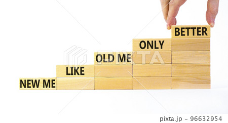 Better new me symbol. Wooden blocks with words 'new me like old me only better'. Beautiful white background, copy space. Businessman hand. Business and better new me concept. 96632954