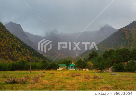 Soft focus. Dramatic view of amazing mountain  village in North Ossetia. Awesome highland scenery with beautiful glacial rainy hills and rocks. Digoria. Caucasus Mountains. 96633054