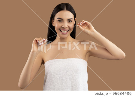 Cheerful beautiful half-naked woman using dental thread 96634406