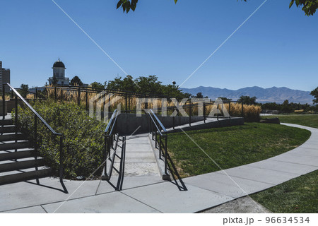 Grassy park view on a sunny day.  96634534