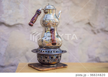 Teapot with tea. Turkish tea concept. Travel in Turkey. Go Everywhere Teapot with tea. Turkish tea concept. Travel in Turkey. Go Everywhere 96634820