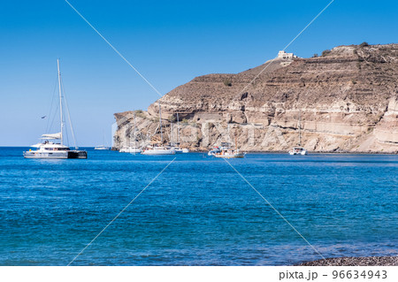 Boat on the aegean sea near Santorini island shore 96634943