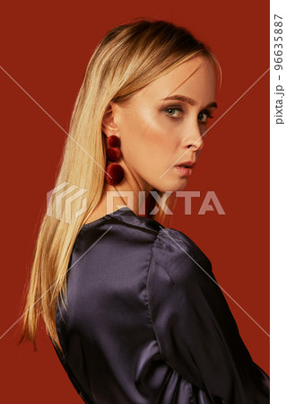 Seductive close up portrait of beautiful blonde young woman in cocktail dress. Side view Seductive close up portrait of beautiful blonde young woman in cocktail dress. Side view 96635887