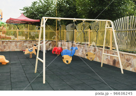Various Children's toys on the playground. Swing carousel in the park for children. 96636245