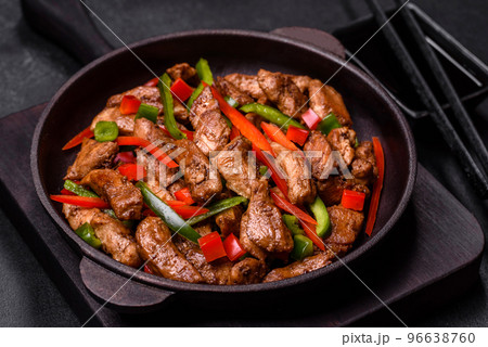 Delicious Asian teriyaki meat with red and green bell peppers Delicious Asian teriyaki meat with red and green bell peppers 96638760