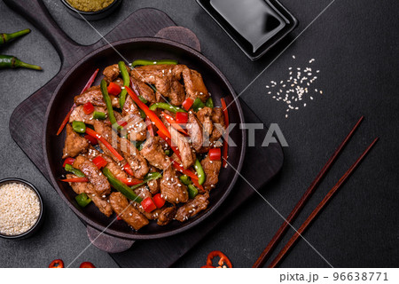 Delicious Asian teriyaki meat with red and green bell peppers 96638771