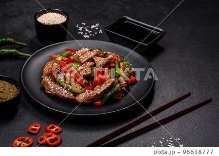 Delicious Asian teriyaki meat with red and green bell peppers Delicious Asian teriyaki meat with red and green bell peppers 96638777