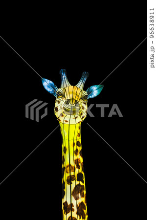 Figure of a giraffe that glows in the dark. Lantern Festival. Giraffe head isolated on black background 96638911