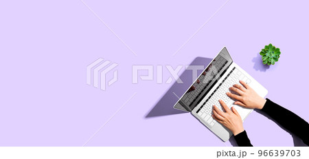 Person using a laptop computer Person using a laptop computer 96639703