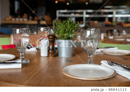 Served tables at beautiful interior of cafe or restaurant 96641113