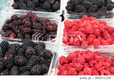 Fresh berries in plastic glasses for sale in market Fresh berries in plastic glasses for sale in market 96641209