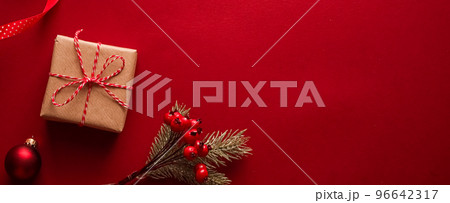 Christmas gifts, boxing day and traditional holiday presents flat lay, classic xmas gift boxes on red background, wrapped present with festive ornaments and decorations for holidays flatlay design Christmas gifts, boxing day and traditional holiday presents flat lay, classic xmas gift boxes on red background, wrapped present with festive ornaments and decorations for holidays flatlay design 96642317