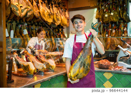 Owner of butcher shop selling traditional spanish jamon 96644144