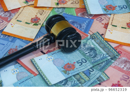 Top view of various Malaysia Ringgit currency with gavel. Money concept. Top view of various Malaysia Ringgit currency with gavel. Money concept. 96652319