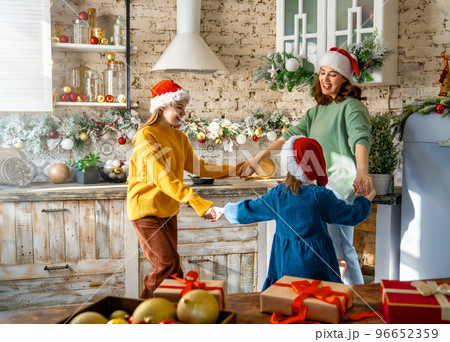 family preparing for Christmas family preparing for Christmas 96652359