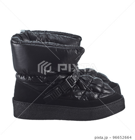 Beautiful pair of women's winter fabric boots in black, with a warm boot and an anti-slip sole, isolated on a white background. Side view. Beautiful pair of women's winter fabric boots in black, with a warm boot and an anti-slip sole, isolated on a white background. Side view. 96652664