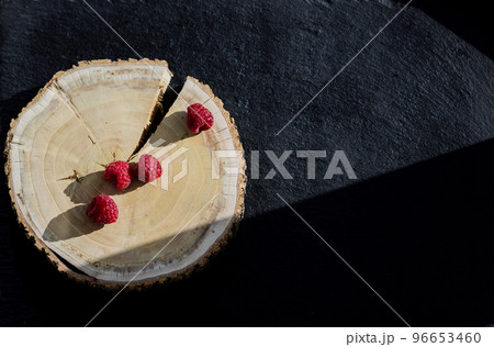 Ripe raspberries on black slate board Ripe raspberries on black slate board 96653460