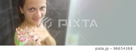 Young woman take hot shower after hard day, cleansing with washcloth 96654368