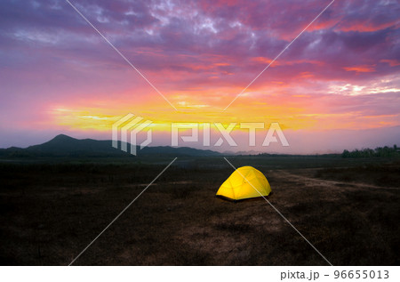 Camping with Yellow tent under the beautiful sky in the morning before the sunrise, Lampang, Thailand. 96655013