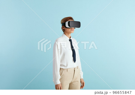 Focused Businesswoman Trying VR. Portrait of Girl Discovering New Technologies Focused Businesswoman Trying VR. Portrait of Girl Discovering New Technologies 96655847