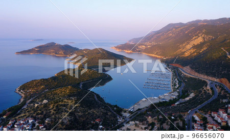 Aerial panoramic view from drone of sea bay surrounded by mountains. Top view of cityscape of resort town. 96656070