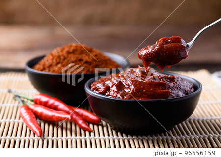 Gochujang (red chili paste), spicy and sweet fermented condiment in Korean food Gochujang (red chili paste), spicy and sweet fermented condiment in Korean food 96656159