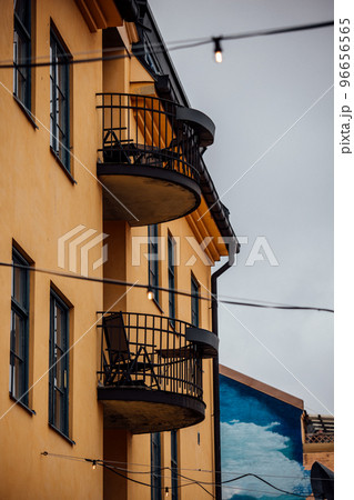 facade of a yellow house in Sweden with balconies 96656565