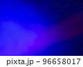Blurred background with blue and pink smoke illuminated by rays. Stage light. 96658017