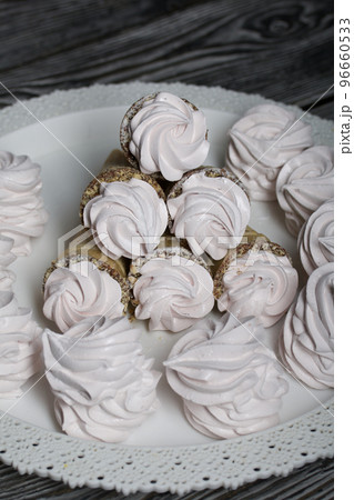 Homemade marshmallows in waffle cones. Homemade zephyr. 96660533