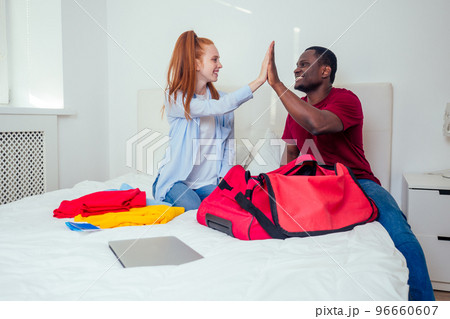 satisfied latin hispanic brazilian husband and redhaired ginger girl moved to a shared apartment.mortgage rental concept satisfied latin hispanic brazilian husband and redhaired ginger girl moved to a shared apartment.mortgage rental concept 96660607