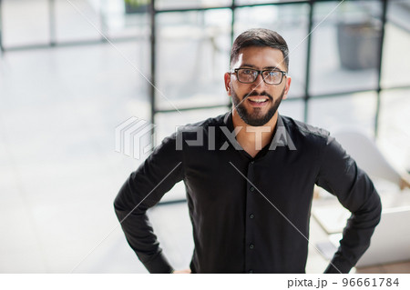 Portrait of smiling young businessman in office 96661784