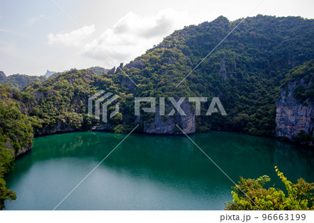 Beautiful lake of Ko Mae Ko island with tropical plants on rocky cliffs Beautiful lake of Ko Mae Ko island with tropical plants on rocky cliffs 96663199