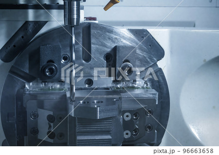 The 5-axis CNC milling machine  hole cutting on the metal  part. 96663658