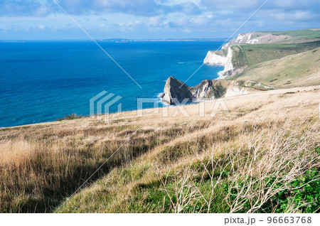 Beautiful views of nature on way to Durdle door in Lulworth, Dorset, United Kingdom. Part of Jurassic Coast World Heritage Site, view of stone formations and sea, selective focus 96663768