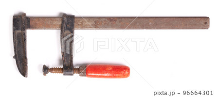 Big old metal clamp or Joiner clamp wood tools, isolated Big old metal clamp or Joiner clamp wood tools, isolated 96664301