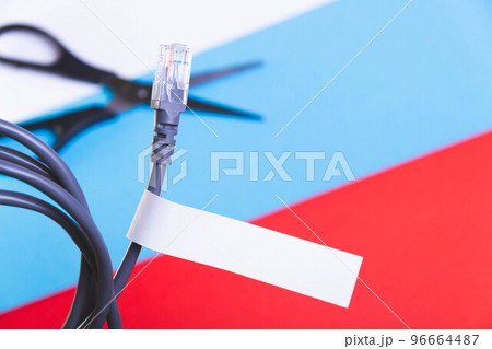Internet cable and scissors cut it. Disconnection of Internet network. Connection to World Wide Web. 96664487