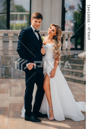 Beautiful bride and groom blonde near the classic building.  96665441