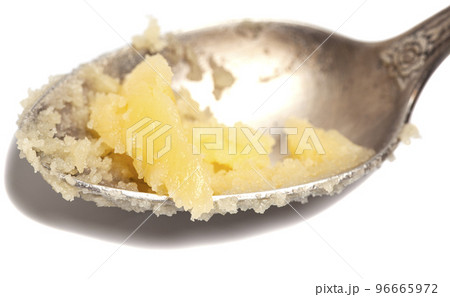 Ghee in spoon isolated on white background. 96665972