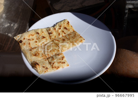 Making of traditional turkish gozleme pancake Making of traditional turkish gozleme pancake 96667995