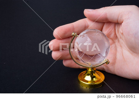 Hands protecting the globe against the global risks and dangers Hands protecting the globe against the global risks and dangers 96668061