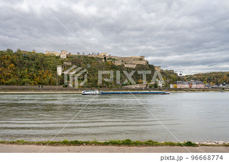 German corner, Koblenz were Rhein and Mosel meet. A river barge in the foreground with the fortress Ehrenbreitstein in the background German corner, Koblenz were Rhein and Mosel meet. A river barge in the foreground with the fortress Ehrenbreitstein in the background 96668774