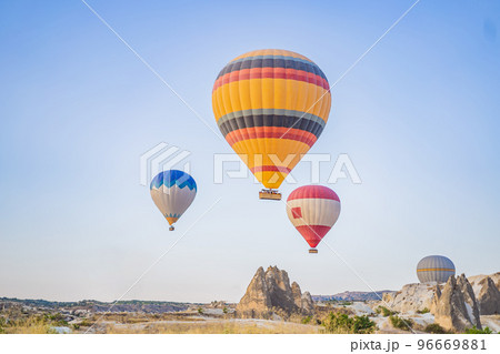 Colorful hot air balloon flying over Cappadocia, Turkey 96669881