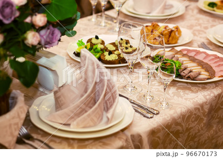 good served table in a restaurant good served table in a restaurant 96670173