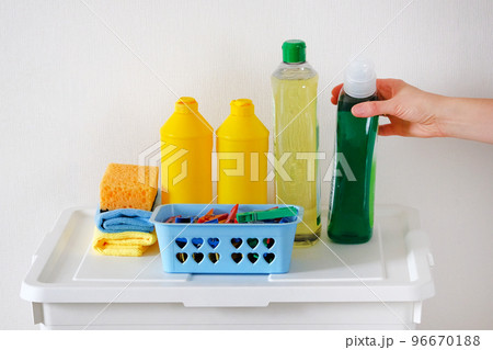 Cleaning concept. Detergent for cleaning room. Plastic bottles with cleaning agent and micro fiber cloth wipes. Maid or housewife cares about house. 96670188