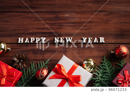 Christmas and new year concept. Gift boxes and decor on wooden background. Christmas and new year concept. Gift boxes and decor on wooden background. 96671233